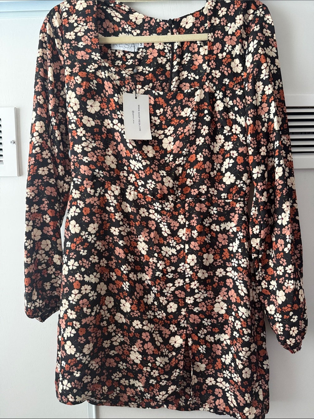 Resa long sleeve mini dress with front slit. Size medium. Nwt.